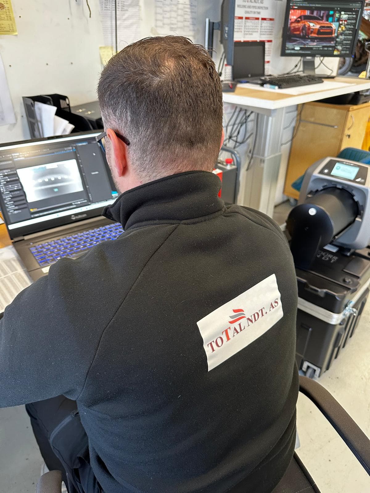 Profesional inspector setting up the x-ray machine for X-ray inspection